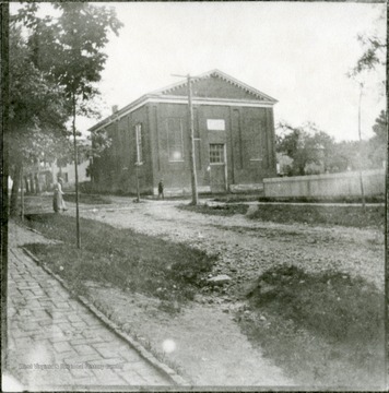 View of the Old Northern Methodist Church, on the corner of Church and New Streets; Beyond, the home of Mr. Jimmy Myers.