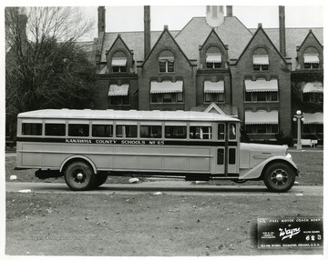 View of Kanawha County School Bus number 65. 'Wayne all steel body, model 4360. Lenght 23' 9", width 95", inside height 67". Body is installed on Diamond T chassis, Model 412-B, 250" wheelbase. Special equipment features include: (1) Streamline hood and cowl (2) Special lettering on body sides.'