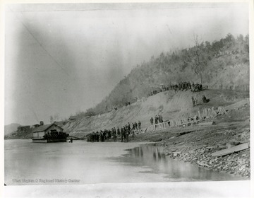 View of a Baptism on a barge near Raymond City, West Virginia.