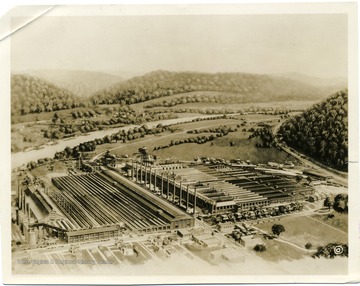 Artists rendering of the Owens Bottle Company (left) and the Owens-Illinois Glass Company (right) at Owens near Charleston W. Va. along the Kanawha River and the Chesapeake and Ohio Railroad main line.