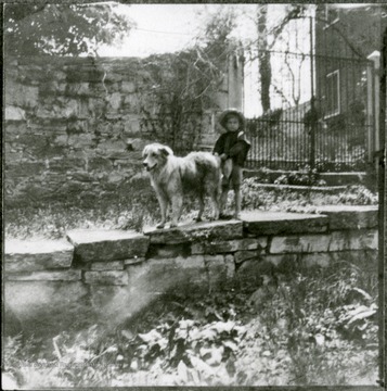 Gate to old Shepherd graveyard, and east end of Episcopal rectory. Strother Athey and dog.