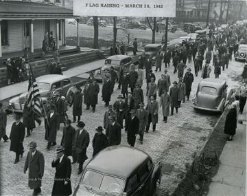 A scene from the flag raising parade for the Fostoria Glass Company.