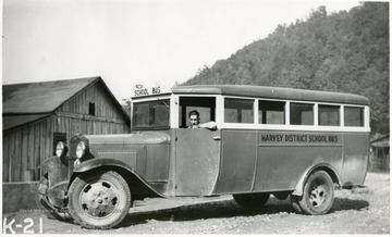 Harvey District school bus. This picture was taken at Trace, W. Va., Two school buses are used between the district line and Dingess.