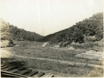 Taken from the railroad at the west end of Dingess Passing Siding looking west to show highway and abandoned coal operations with reference to the railroad.