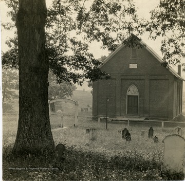 A view of the Broad Run Baptist Church and cemetery in Lewis County. 'Some of Lewis County's best known and ablest men and women have worshipped within the walls of the old Broad Run Baptist Church. It is where Tom Jackson [Confederate General Thomas "Stonewall" Jackson] and Joe Lightburn [Union General Joseph Lightburn] attended church and Sunday School.'