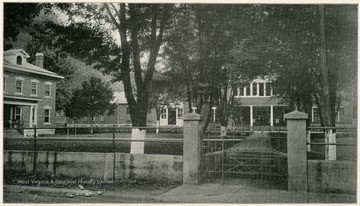 View of the gate at the Front Entrance, Welch State Hospital No. 1, McDowell  County, W. Va.  'C. F. Hicks Superintendent.  This institution is located at Welch, McDowell County, and is reached by the Norfolk and Western Railroad.  Number of patients treated during June, 1918 - 200.'