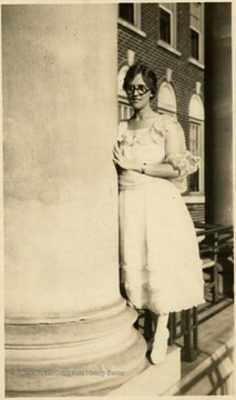A photograph of Margaret B. Ballard standing outside. 