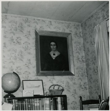 A portrait of Eliza Peters Byrnside hanging on a wall.
