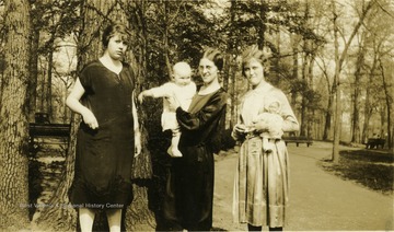 'Isn't the baby cute? - Maggie, Helen and unknown friend of Uncle William and Aunt Lottie.'