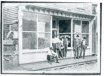 W. W. Logan, W. W. Johnson and others are standing in front of W. W. Logan's Print Shop in McDowell County, West Virginia.