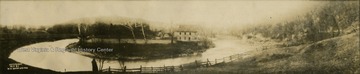 A panoramic view of the mill and the river surrounding it.