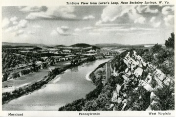 'Panorama view from Lover's Leap, on State Route 38 between Berkeley Springs, W. Va. and Hancock, Maryland.  Three states are included in this Panorama: Maryland, Pennsylvania and West Virignia.  Left to right photo includes: on Maryland side, Western Maryland Railroad; Chesapeak and Ohio Canal, now owned by the government, spans a scenic highway in the old canal basin; Town of Hancock Md. in background, Mt. ranges beyond town are in Pennsylvania; Potomac River in center.  On W. Va. side: Main Line B&amp;O RailRoad, Pa. Glass Sand Co. Pant; sand and stone formation to right is part of Lover's Leap.'