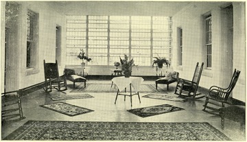 An interior view of the sun parlor at Spencer State Hospital.
