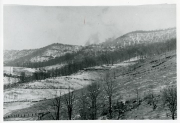 The smoke of a logging train on Spruce Mountain, from Middle Timber Ridge in Pendleton County, West Virginia.