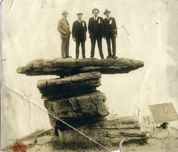 'W.A. James, Geo Bair, E.C. Minter and W.M. Taggart atop a rock where Wauhatchie was fought.'