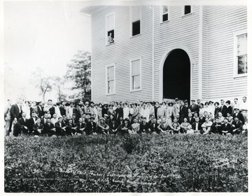 Group portrait of the Teacher's Institute participants in front of the Old Franklin Elementary/High School.