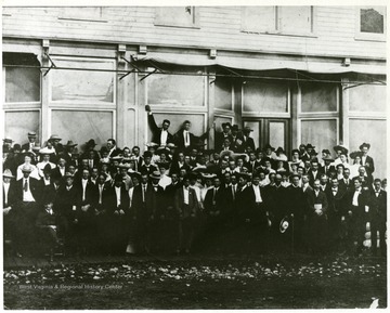 Group portrait of participants in a Teacher's Institute.  Photograph taken in front of O. D. Bowman's store building.
