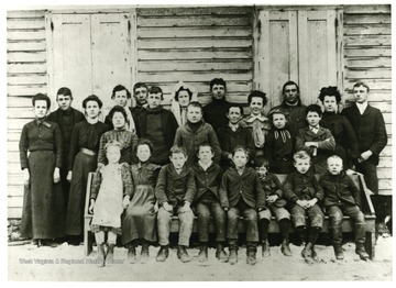 Group portrait of Buffalo Hills School students.  2nd Row: 5th from left; Ott Ruddle.  Back Row: 4th from left; Ona Ruddle,  7th from right; Lura Ruddle,  2nd from right; Clara Ruddle. 