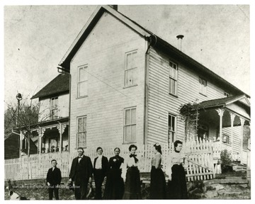 'Built in late 1880s.  Pictured left to right: Ott Ruddle, Henry Clay Ruddle, Ona Ruddle, Hannah Dean, Luna Ruddle (Byrd), Maud Ruddle, Clara (Ruddle)Ruddle.