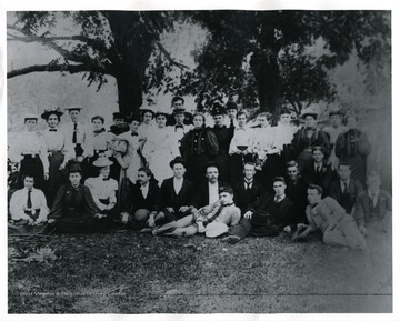 Front, left to right:  Katie Priest, Luna Moyers, Eva Priest, Isaac Pennybacker, Pent Boggs, Jim Lough, Eddie Pennybacker, Byron Boggs, Paul Priest, Press Pennybacker, Osceola Dyer, Roy Campbell, Pink Harman and Mack Davis.  Back, left to right:  Sallie Priest, Laura Davis, Sallie Daugherty, Katie McCoy, Mary Boggs, Carrie Campbell, Mrs. Isaac Pennybaker, Ola Switzer, Margie Boggs, Sam McCoy back of her, Fanny Pennybacker, Annie Daugherty, Mary Mantz, Carry Pennybacker, Susie Daugherty, Kittie Dyer, Vista Lough (died October 29th, 1953), Mamie Kennedy, Mary Daugherty (picture is very dim).  Living in May of 1960:  Katie Priest Campbell, Margie Boggs, Luna Moyers McLaughlin, Eva Priest Stites.