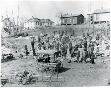 People gather in the aftermath of the fire that occured at the Stout Hardware Company.