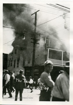 People are watching a Tavern Fire in Sistersville, West Virginia.