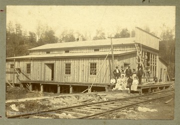 A group portrait on the steps at the Crow Store while under construction in Raleigh County, W. Va.