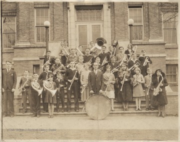 Group photo of the band members and instructor in the earlier part of the 20th century. Subjects unidentified. 