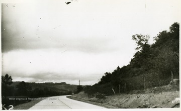 'Type of concrete-surfaced highway along US Route #52. Picture made near County Farm in Wayne County.'