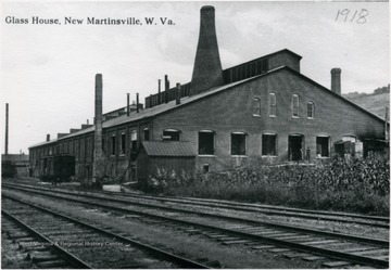 View of the Glass House next to some railroad tracks in New Martinsville.