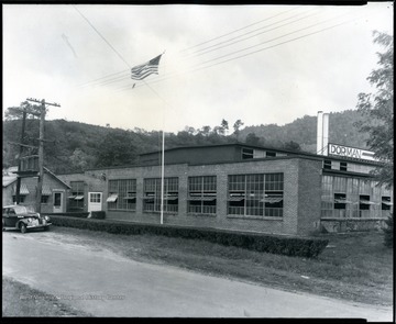'The Dorman Woolen Mill in Parsons, Tucker County, W. Va., built in 1922, is one of only two industries left in Tucker Co., the other is a tannery at Parsons.   O. Homer Floyd Fansler, Hendricks, W. Va. is written on the back of the photo.'