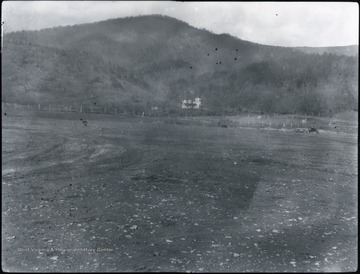'An example of soil erosion in Tucker County, W. Va. caused by the depletion of the virgin forests by the early lumbering industries in the county. O. Homer Floyd Fansler, Hendricks, W. Va. is written on the back of the photo.'