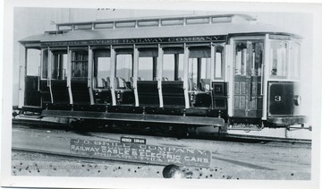 A close-up view of Wetzel and Tyler Railway Company Number 3 cable car, in New Martinsville, West Virginia. J.G. Brill, the builder made this railway car which seated 28 passengers. Later became Sistersville and New Martinsville Tractor, Company.