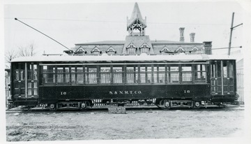 A close-up view of Sistersville and New Martinsville Tractor Company, Number 16, in New Martinsville, West Virginia. Wason Company build this cable car in 1921 which seats 48 passengers. Car part of an order for three cars.