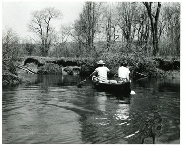 View of two people paddling a canoe at Canaan Valley.