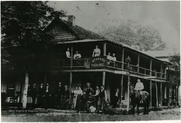 People standing out in front of Standard House, an early hotel in Webster Springs.