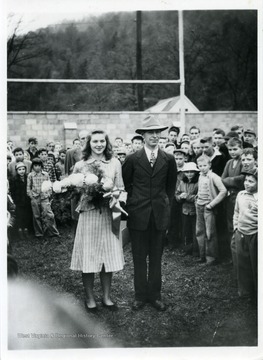 Janet Cutlip, first "Miss Wildcat" of WSHS, with her father, L. Glenn Cutlip, at football game in 1947.