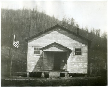 'Cool Springs Grade School was a few miles southeast of Diana. Windows indicate that it was of late construction, probably about 1930. In 1934-1935, it became one of the first one-room model schools in Webster County. Many students who enrolled in Webster Springs High School had been pupils or teachers in one-room schools. In later years, alumni of the high school had an important role as teachers in one-room schools.'