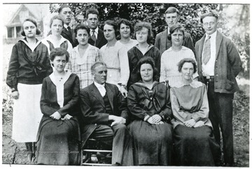 Knabenshoe Class Mountaineers. Sitting left to right: Lennie Hamrick, E. H. Knabenshoe, Genevive Hines and Pearle Miller. Second row: Rosalie Criss, Mae Hamrick, Ruth Woodsell, Daisy Chapman, Lula Dyer, Dessie Miller and Ardey Anderson.  Last row: Harley Bennett, Franklin Hamrick, Rossie Hammon and Hinley Gregory. Webster County, W. Va.