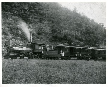 Passengers are riding the Holy River and Addison Railroad, the first train into Webster County, West Virginia.