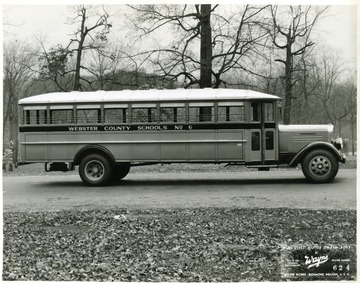 'Wayne All Steel Body, Model 4360.  Length 23'9'', width 95'', inside height 67''.  Boy is installed on GMC, Model T-33 chassis, 234'' wheelbase.  Special equipment features include:  1. Genuine leather upholstery, 2. #1569 book racks, 3. #1513 window guard rails, 4. Special lettering.'