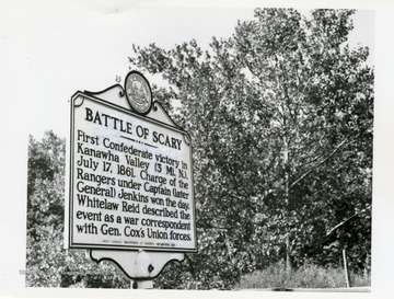 A close-up view of the Historical Marker: "'Battle of Scary' First Confederate victory in Kanawha Valley (3 Mi. N.), July 17, 1861. Charge of the Rangers under Captain (later General) Jenkins won that day. Whitelaw Reid described the event for the Cincinnati Gazette as an embedded war correspondent with Gen. Cox's Union Forces." 'This is the site of the first major Civil War skimish in the Kanawha Valley.'