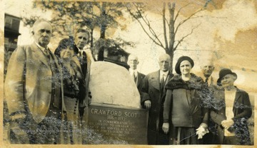 Seven unidentified people and the Crawford Scott Memorial.