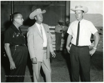 Standing, left is J. W. Ruby, the founder of Ruby Sterling Farms. The others are not identified.