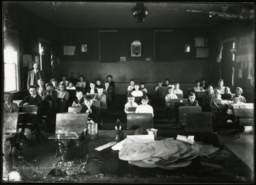 Children are seen in their one room school.