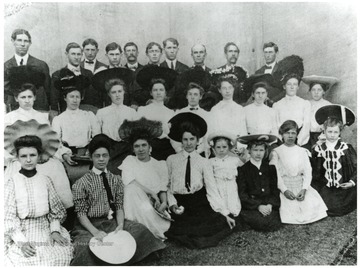 Portrait taken at Wana, W. Va. Evergreen Musical Singers.  Top row- Marshall Efaw, Jess Cross, John Barr, Harland LeMasters, Griff Cross, Laurel Billingsley, Bill Haught, Lee Wise, Ashberry Cross, Saul Tennant.  Second row- Bill Haught, Alice Wise, Cora Mason, Maude Cross, Nell Barr, Ella Barr, Hattie Le Masters, Harriet Stewart, Levina Clayton.  Third row- Martha Stewart, Iva Haught, Jessie Haught, Eva Cross, Hazel Cross, Goldie Wise, Leva Haught, Grace Wise.