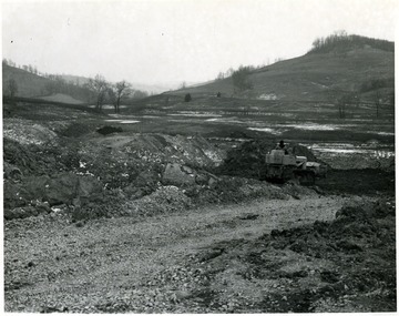 A bulldozer moves dirt at the site of the National Training School for Boys.