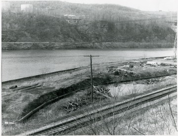 View of railroad track along river.