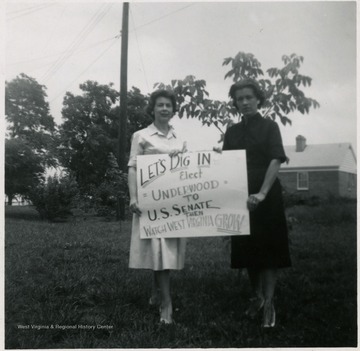 Two Ladies of Martinsburg for Martinsburg and Neely. They are holding up a sign that reads ' Let's dig in, elect Underwood to U.S. Senate, then watch West Virginia grow.'