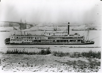 Sign on the side of the steamer says:  'Cincinatti Centennial Exposition'.